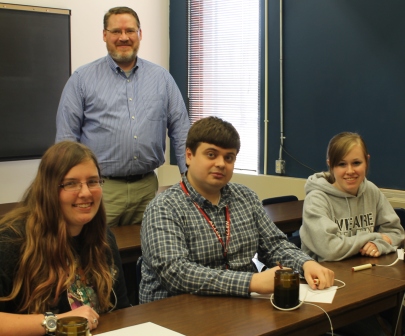 Members of the Allen Academic Excellence Challenge team are, seated from left, Laura Howard, Pavel Kuropatkin, and Arli Hendrix. Standing is Todd Francis, the sponsor. Not pictured are Shayla Stephens and Lorraine Kuzen-Stephens.