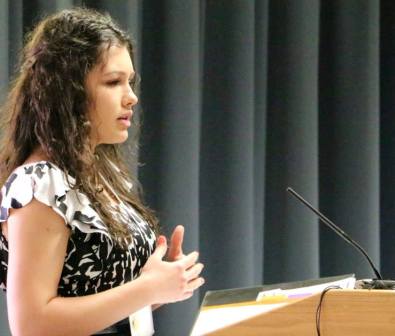 Elvira Avdeyeva gives her speech before a gathering of PTK groups in Kansas. She was elected vice president of the Southern District of state chapters.