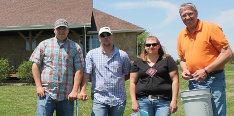 Students who live and work at the Allen farm include, from left, Reid Shipman, Dakota Ferguson, and Danielle Gerdsen. They are with Terry Powelson, right, an agriculture instructor at the college.