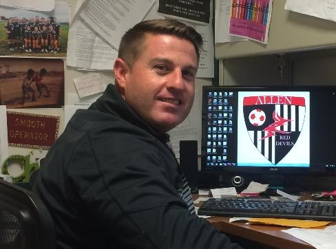 Jeremy McGinnis, head coach of Allens womens soccer team, spends much time researching on his computer during the off-season.