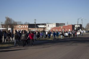 Iola High School students and faculty participate in the #ENOUGH: National School Walkout by walking around the Iola Square in support of safety in schools.