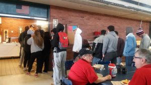 Students wait in line to get lunch from new food service providers, Great Western Dining. 