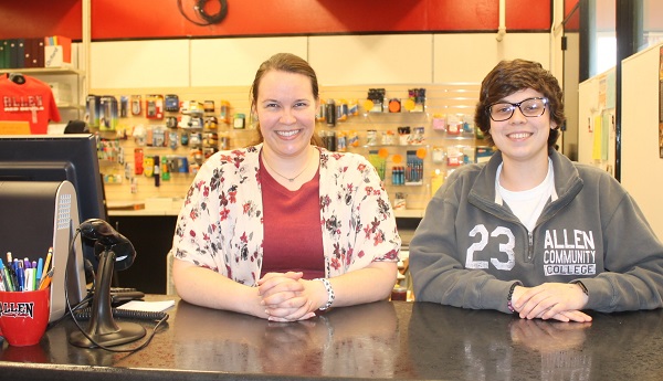 Reine Loflin, left, and Savannah Williams happily greet students in the Allen Bookstore, which has been relocated to the B Complex near the mailroom.