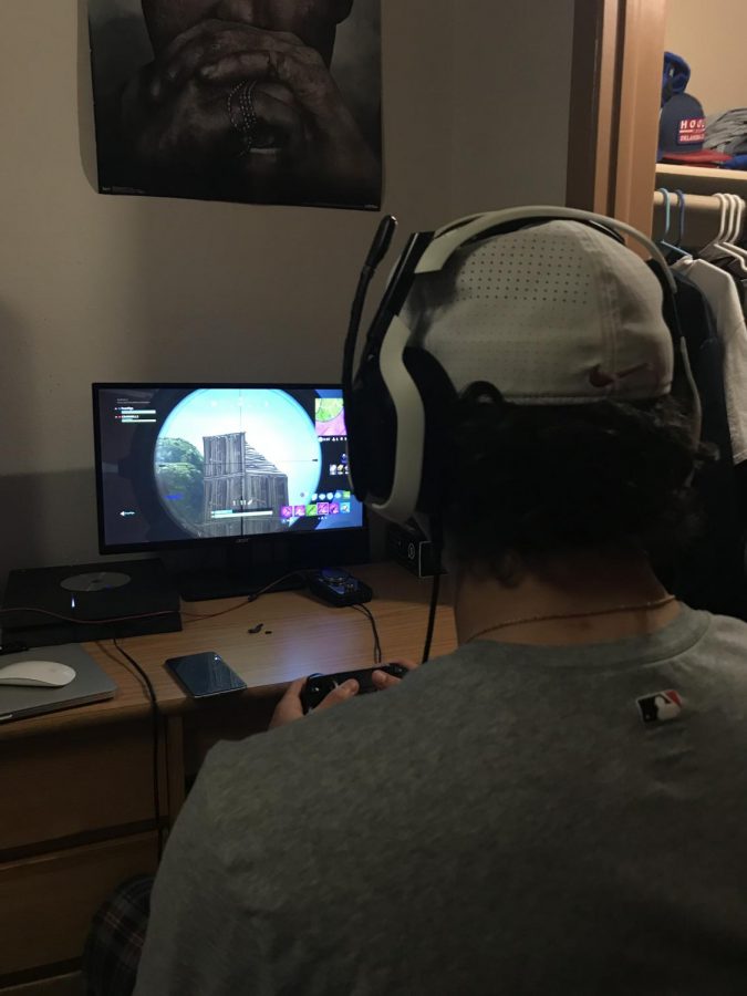 Conner Darnell plays Fortnite in his dorm room, like many other students at Allen Community College.