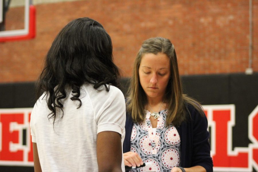 Head+Coach+Rachel+Janzen+discusses+plays+with+assistant+coach%2C+Cindee+Wright.