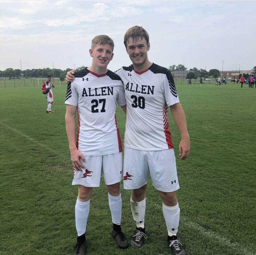 Regan McDonald and Dylan Hawley pose after the first game of the season. 