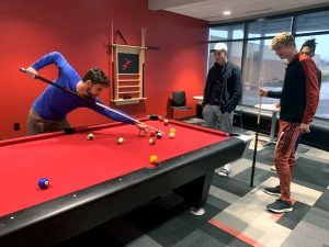 Freshman Justin Carpenter plays pool in the new student center at Allen Community College. The center will officially open Weds. Jan. 23 at 3 p.m.