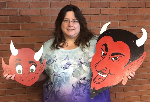 Virginia Shaffer, Allen library director and member of the Centennial Celebration Task Force, displays Allen Red Devil logos from the past which will be incorporated into displays promoting the schools 100th birthday.
