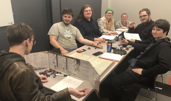 Those participating in a table game group at Allen Community College include, from left, Bobby Whitsell, Julius Hodges, Jake Andersen, Carolyn Appleton, Zohreyha Masuch, Bryce Atzbach, and Ryan Clary.