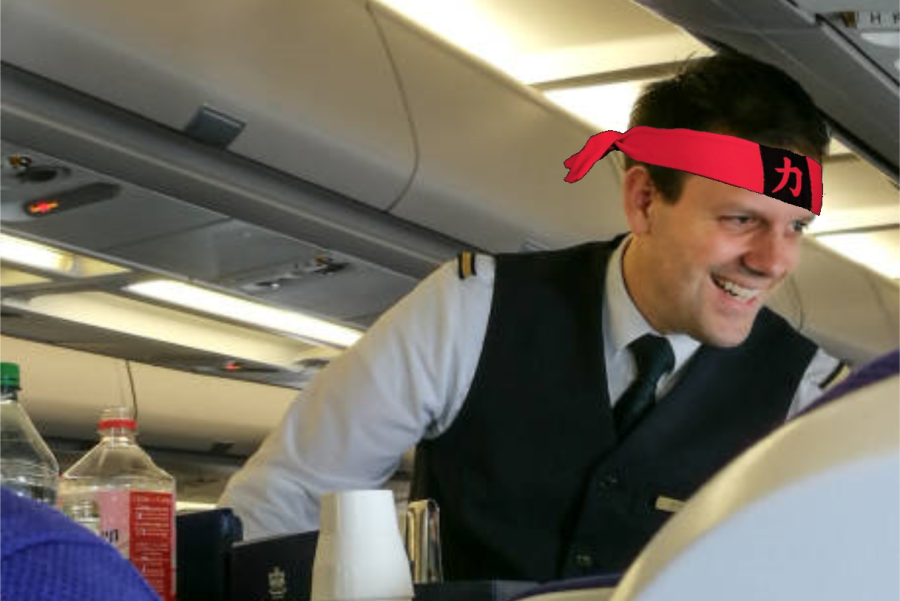 American Airlines attendant sports Karate headband after week-long training. 
